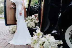Classic Getaway Car with White Monochromatic Flower Arrangements | Tampa Bay Rental Car Service Classically Ever After | St Pete Florist Marigold Flower Co