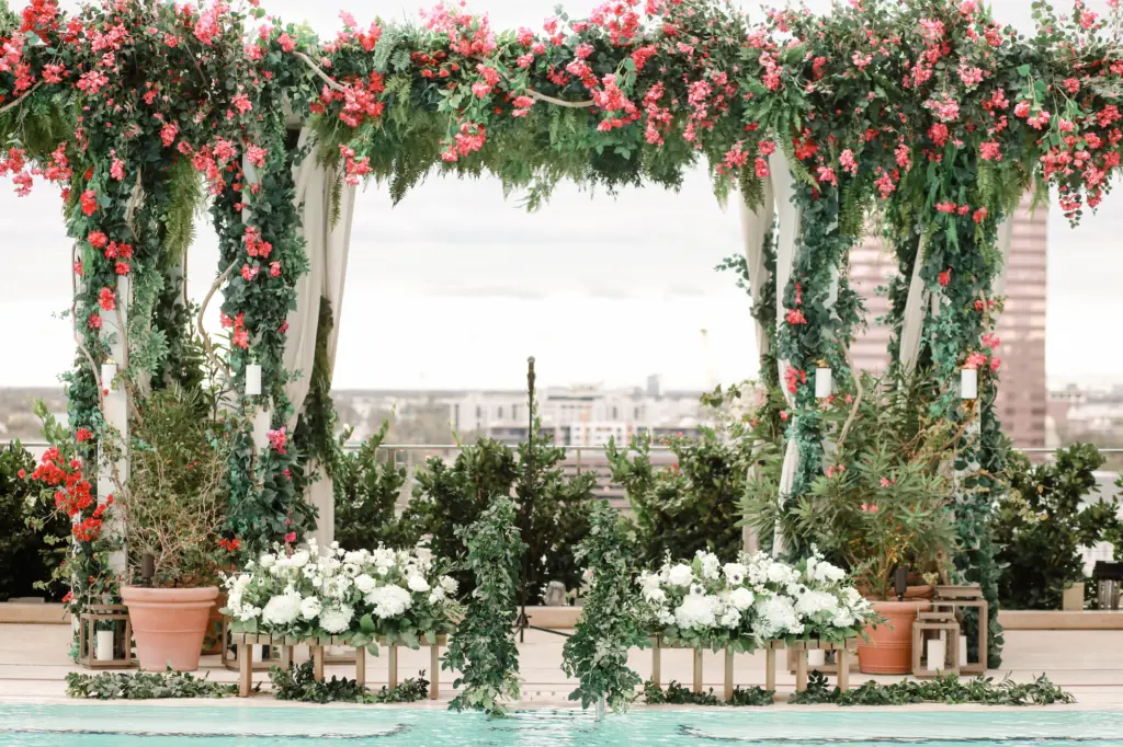 Romantic Sunset Wedding Ceremony Altar Decor Inspiration | Extravagant Tall Bougainvillea and Fern Backdrop with White Hydrangeas, Roses, Anemone, and Greenery Decor Floor Arrangements | Tampa Bay Planner Breezin Weddings | Downtown Event Venue The Edition Hotel Tampa Water Street Rooftop