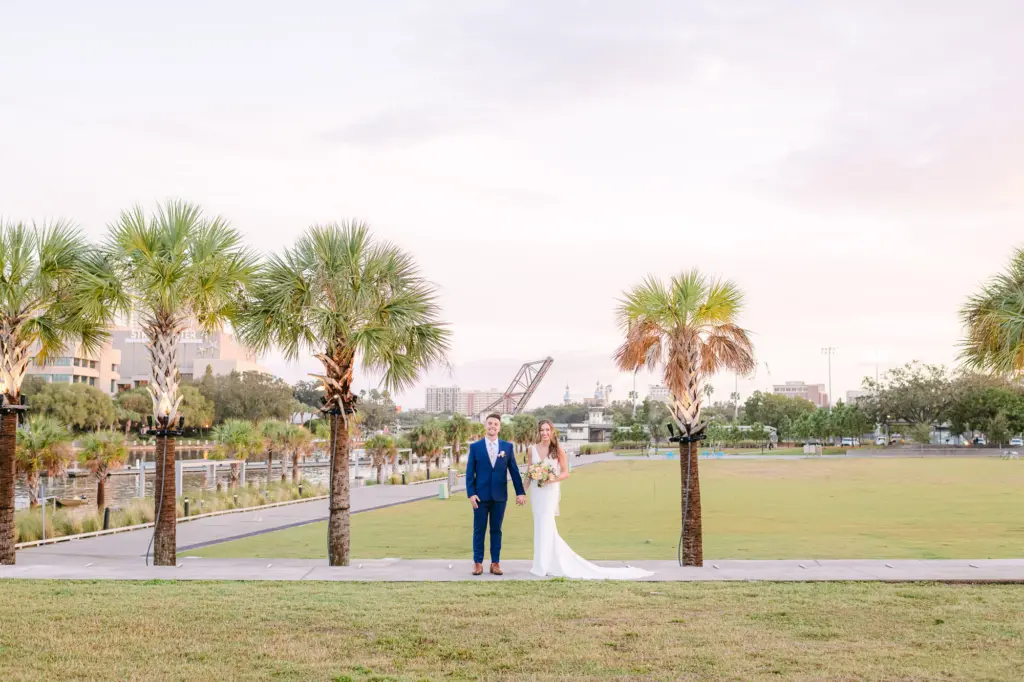Bride and Groom Sunset Downtown Tampa Wedding Portrait | Riverwalk Event Venue Tampa River Center Julian B Lane Park