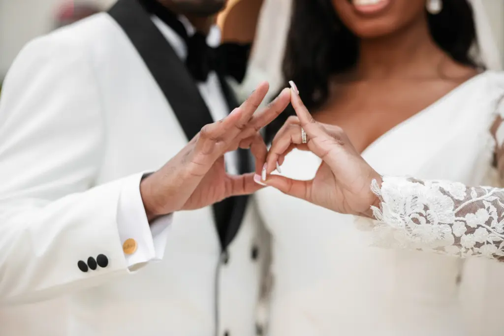 Bride and Groom Sorority and Fraternity Hand Signs Wedding Portrait