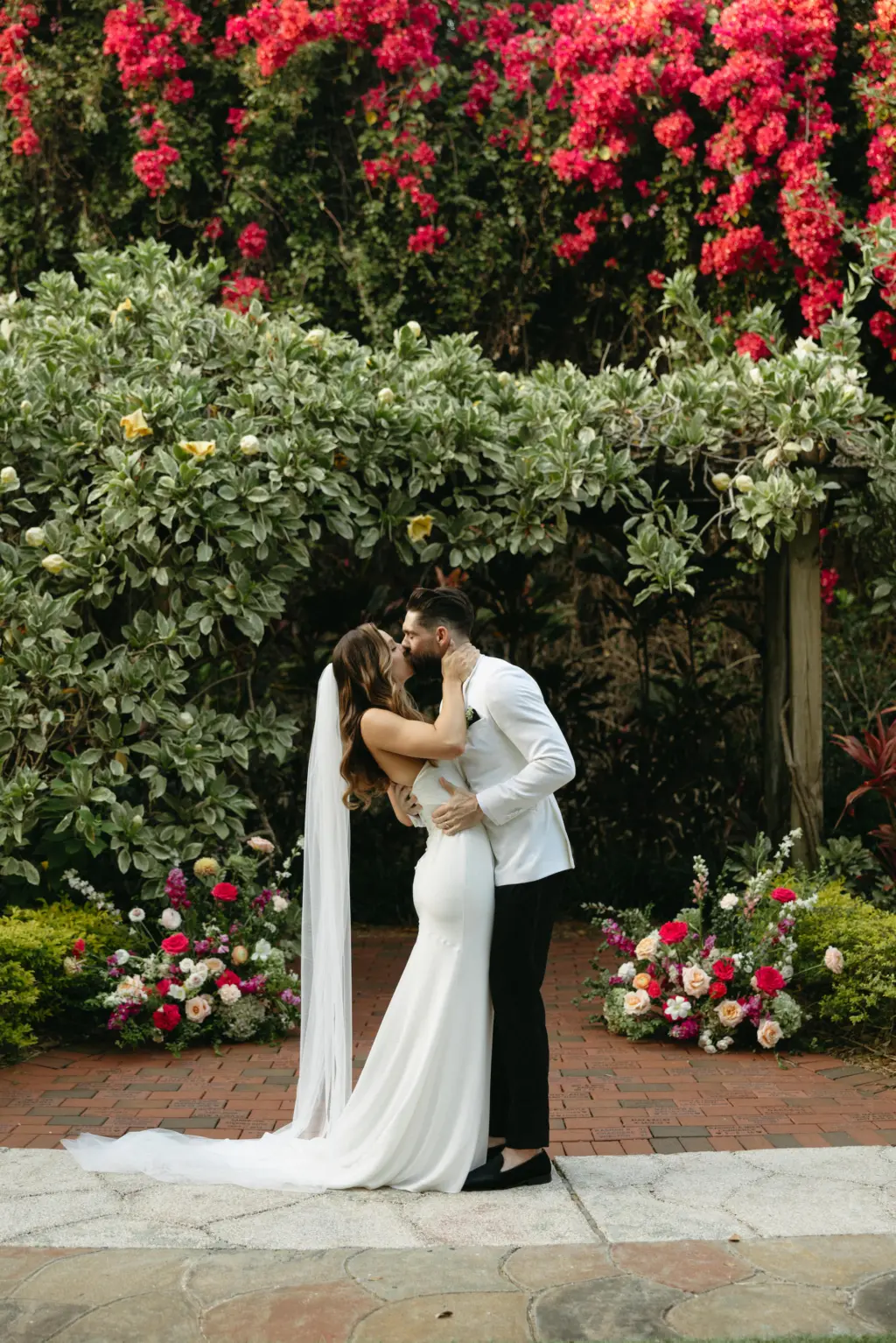 Bride and Groom First Kiss Wedding Portrait | St. Petersburg Florida Outdoor Event Venue Sunken Gardens