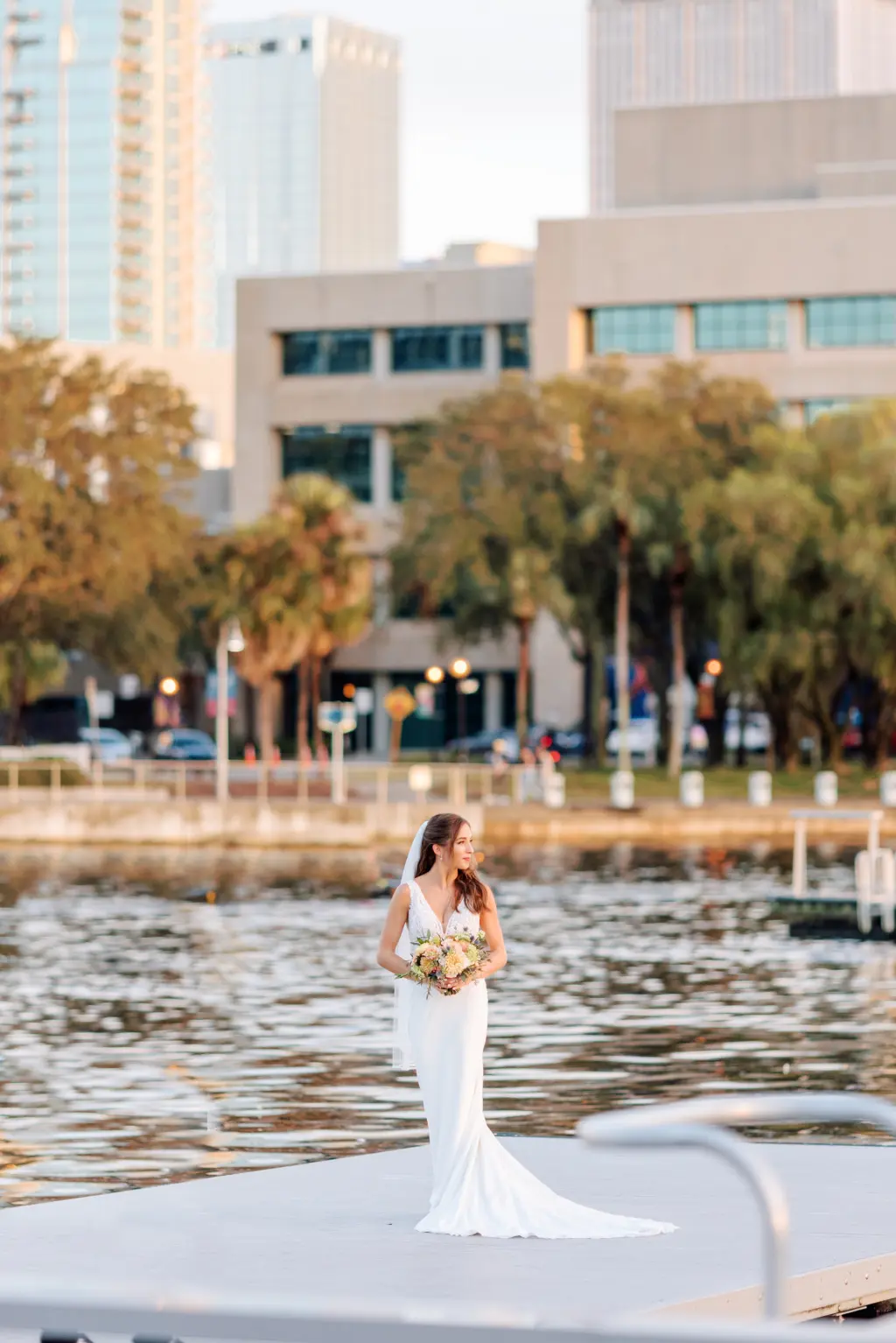 Elegant Hair and Makeup Ideas | Ivory Lace Fit and Flare Wedding Dress Inspiration | Tampa Riverwalk Dock Outdoor Bridal Portrait | Venue Tampa River Center