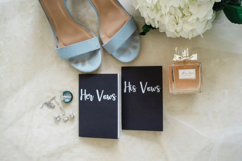 His and Her Vows Black Booklet Inspiration | Wedding Miss Dior Perfume Ideas | Blue Steve Madden Wedding Shoe | Silver Diamond Jewelry