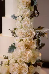 White Garden Roses Cascading Down Wedding Cake Inspiration | Tampa Bay Bakery The Artistic Whisk