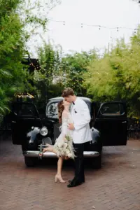 Feathered Second Reception Dress | Classic Getaway Car | Tampa Bay Boutique Truly Forever Bridal | Videographer Sabrina Autumn Photography | St Pete Car Rental Service Classically Ever After