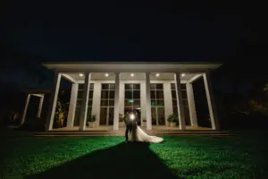Bride and Groom in Front of Tampa Garden Club Wedding Venue | Photographer and Videographer Iyrus Weddings | Wedding Night Portrait Ideas