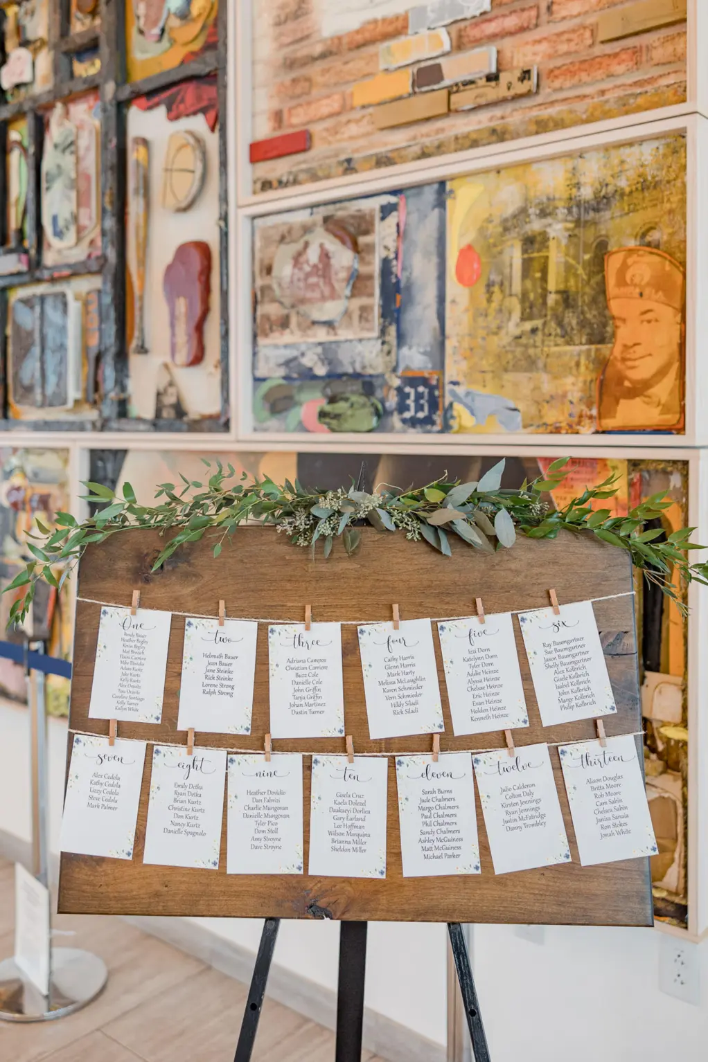 Rustic Wood Wedding Reception Seating Chart Clothesline Cards with Clothespins and Greenery Garland Decor Ideas