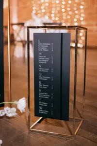 Modern Black, Gold, and White Please Find Your Seat Wedding Reception Seating Chart