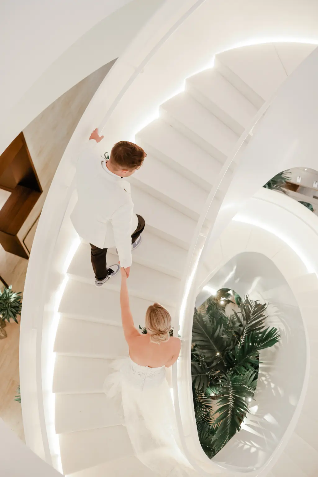 Bride and Groom Walking Up the Stairs | Tampa Bay Wedding Photographer Lifelong Photography | Downtown Event Venue The Edition Hotel Tampa Water Street Lobby Staircase