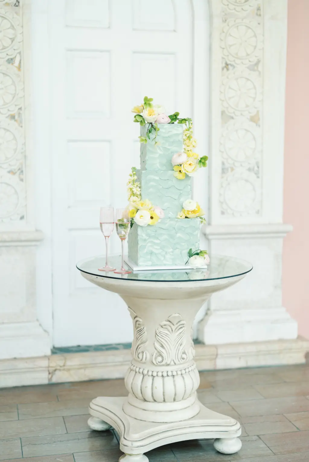 Whimsical Square Three-Tiered Blue Textured Wedding Cake with White and Yellow Rose Accents