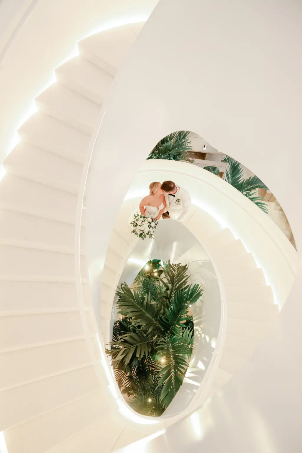 Intimate Bride and Groom Wedding Portrait on Spiral Staircase | Tampa Bay Photographer Lifelong Photography | Downtown Tampa Wedding Venue The Edition Hotel Water Street Lobby Stairs | Planner Breezin' Weddings
