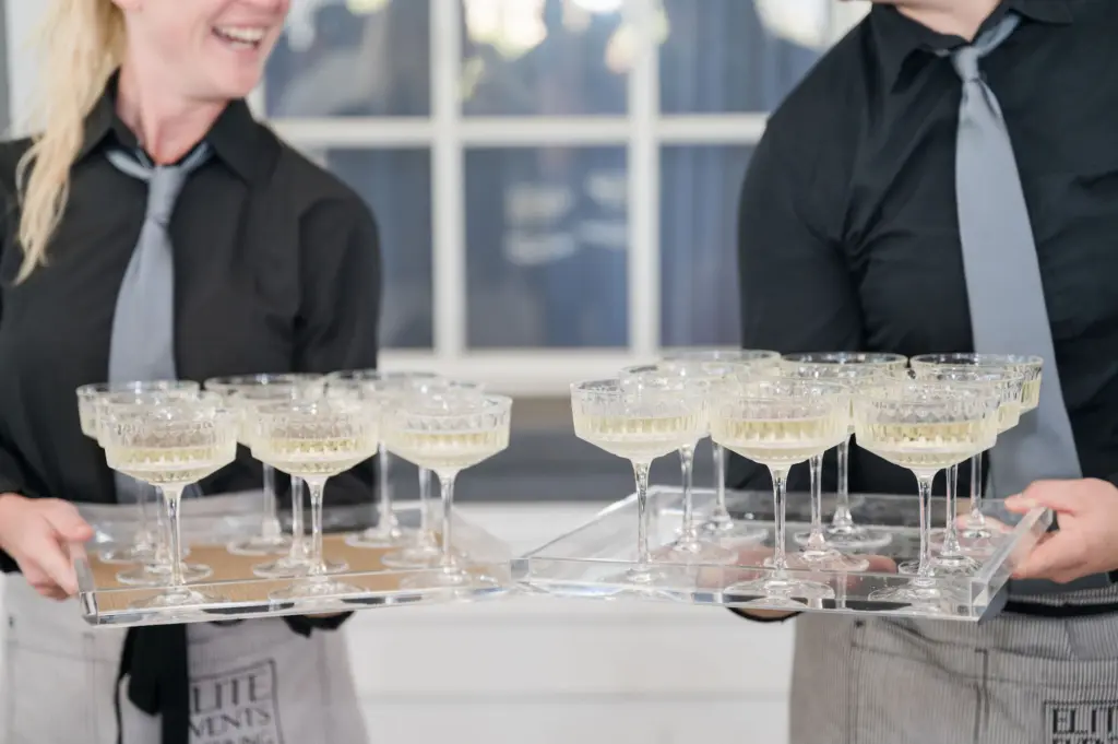 Tampa Bay Elite Events Catering Bartenders Serving Champagne for Wedding Reception