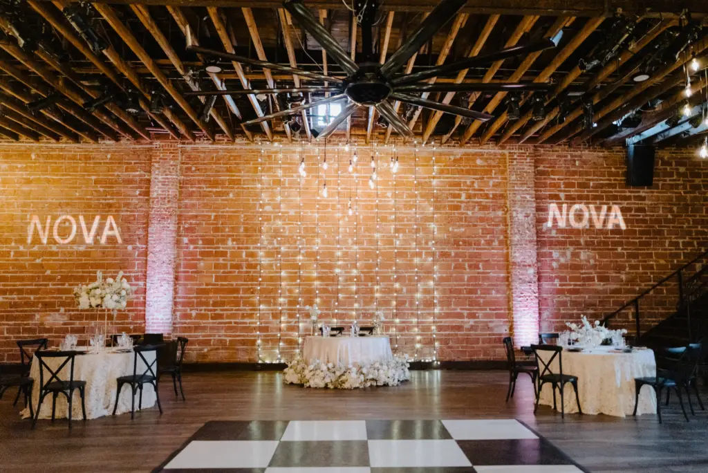Black, White, and Gold Wedding Reception Inspiration at Industrial Venue | Checkered Dance Floor Wedding Receptions Ideas | St. Pete Venue NOVA 535 | Kate Ryan Event Rentals