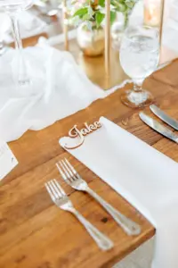 Laser Cut Wood Place Cards with Silver Flatware | Rustic Wooden Wedding Reception Table Decor Ideas | Tampa Bay Caterer Elite Events and Catering