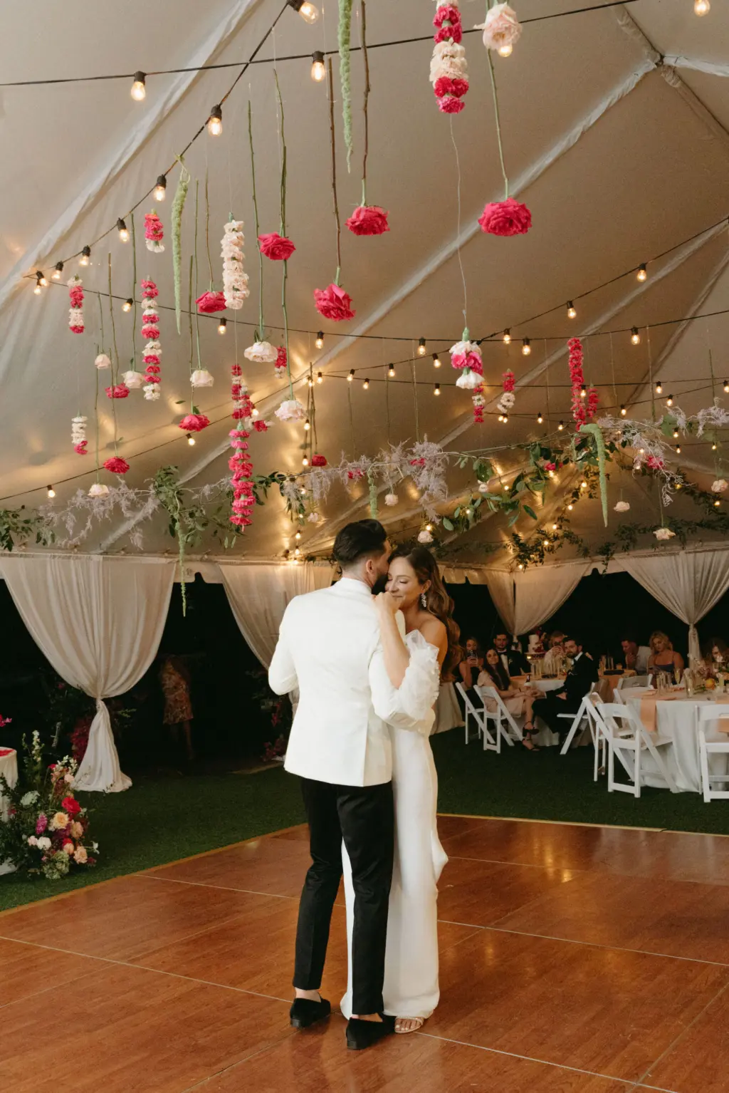 Bride and Groom First Dance Wedding Portrait | White and Pink Tented Garden Wedding Reception Inspiration | Suspended Hanging Roses, Carnations, and Greenery, and Market String Bistro Lights Decor Ideas | St. Pete DJ Graingertainment | Tampa Bay Wedding Planner Wilder Mind Events