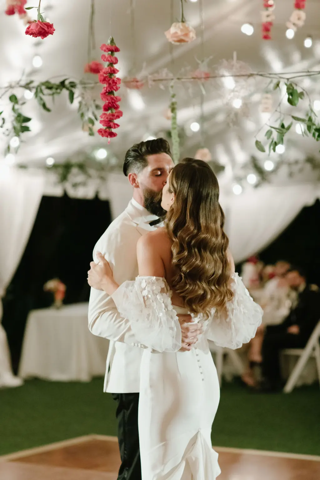 Bride and Groom First Dance Wedding Portrait | White and Pink Tented Garden Wedding Reception Inspiration | Hanging Roses, Carnations, and Greenery, and Market Lights Decor Ideas | St. Pete DJ Graingertainment