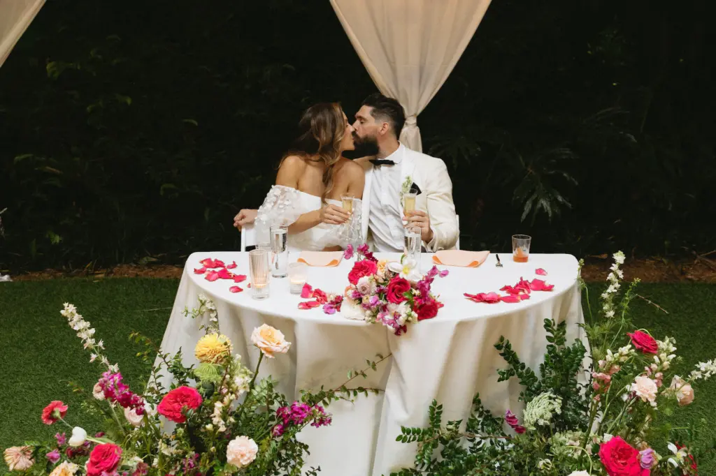 Garden Inspired Wedding Reception Sweetheart Table Decor Ideas | Pink and Blush Roses, Hydrangeas, Carnations, and Stock Flower Floor Arrangement Inspiration | St Pete Planner Wilder Mind Events