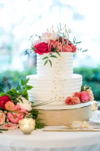 Two-Tiered Round Buttercream Wedding Cake with Pink Roses, Gold Foil, and Custom Cake Topper