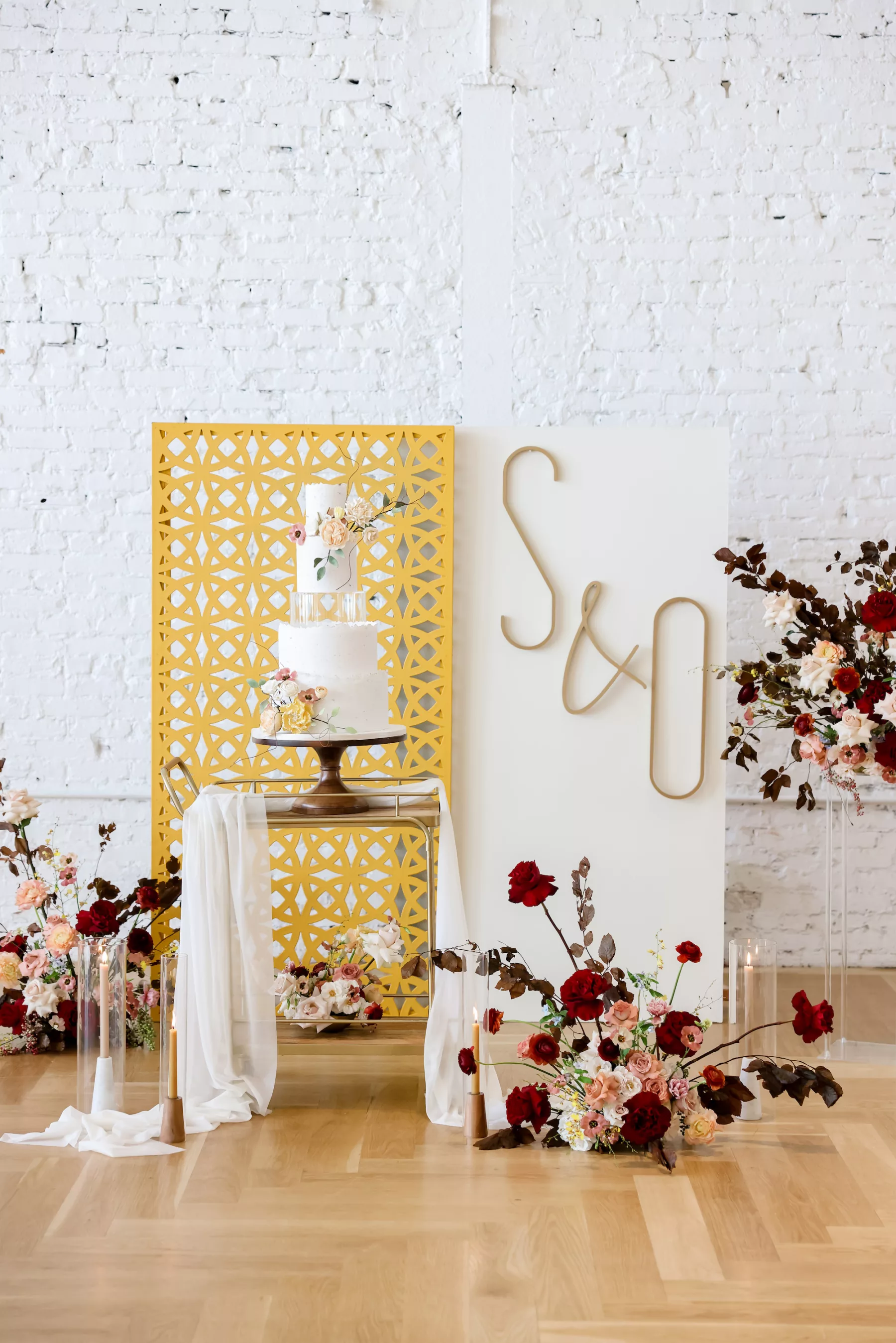 Red and Yellow Retro Wedding Cake table Decor Ideas | Whimsical Red, Pink, and White Rose Floral Decor Ideas | Ybor Planner Blue Skies Events