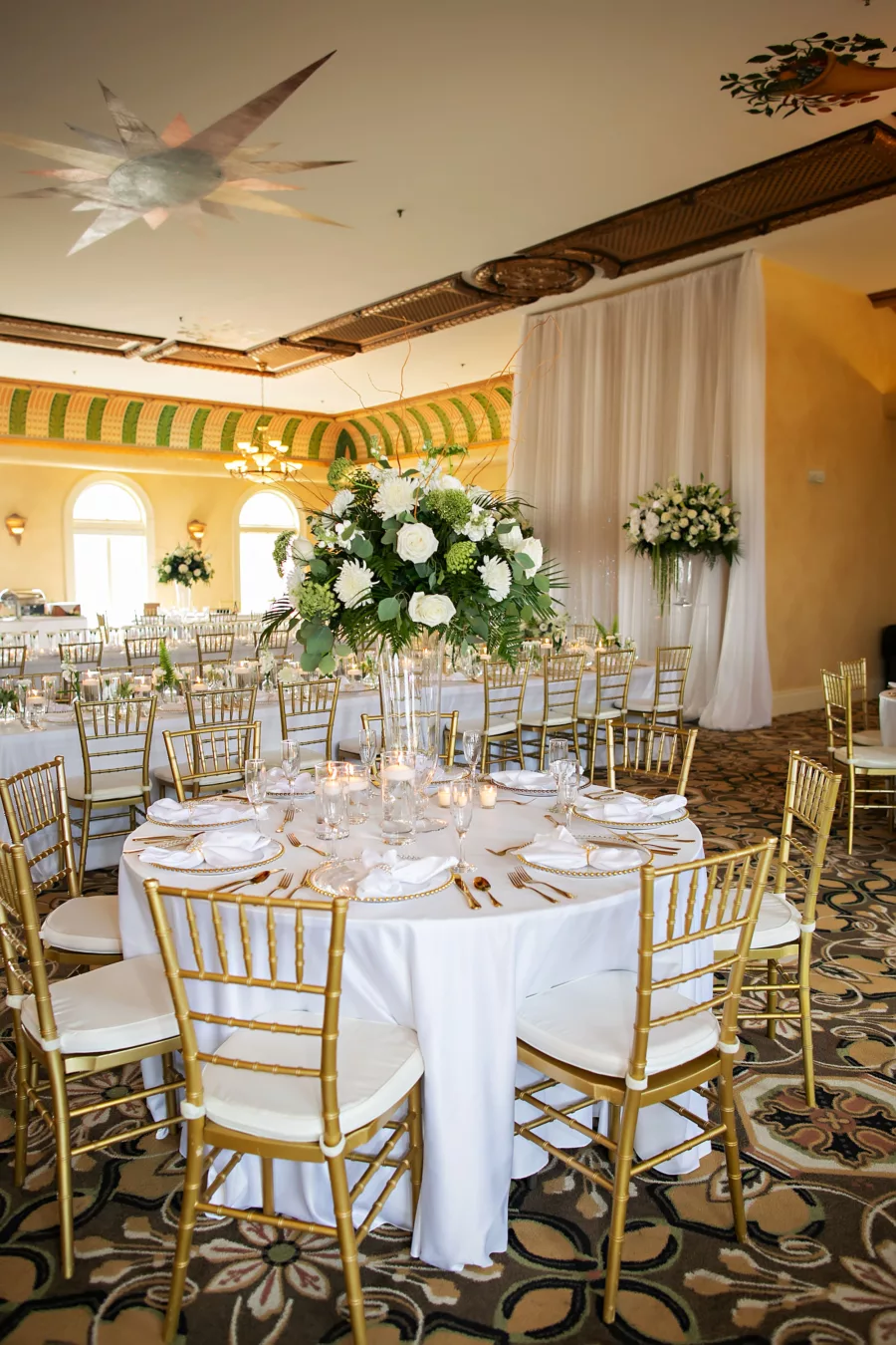 Classic White Italian Inspired Wedding Reception Decor Inspiration | White Drapery, Long Feasting Tables, Gold Chiavari Chairs | Ybor Planner Coastal Coordinating | Outside The Box Event Rentals | Photography Limelight Photography