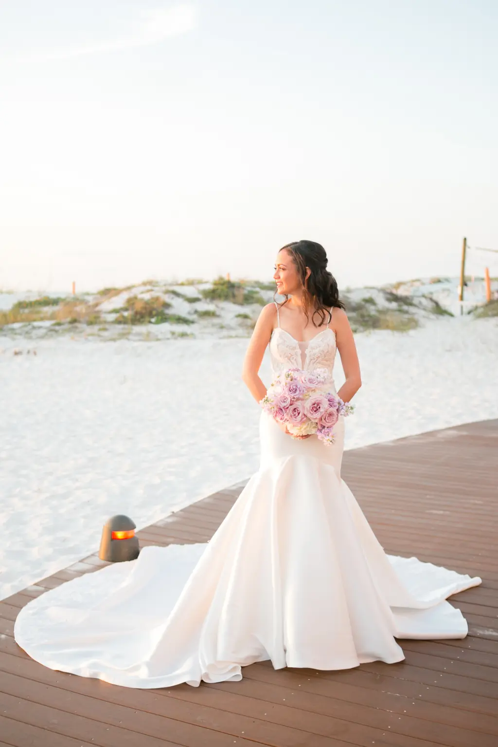 Timeless Bridal Hair and Makeup Ideas | Sunset Wedding Portrait | White Removable Spaghetti Strap Lace and Satin Mermaid Wedding Dress with Cathedral Train Inspiration | Tampa Bay Boutique Truly Forever Bridal | Clearwater Photographer Carrie Wildes Photography | Venue Sandpearl Resort Hotel