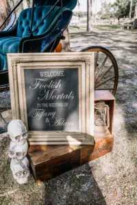 Welcome Foolish Mortals Wedding Sign with Skulls and Antique Lanterns | Elegant Gothic Halloween Wedding Ceremony Decor Ideas