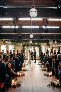 Classic Cascading Lush Greenery Arch Ideas | Candlelight Aisle Decor | Modern Black and White Industrial Indoor Wedding Ceremony Inspiration | Tampa Wedding Venue Oxford Exchange | Planner Wilder Mind Events | Photographer Videographer Sabrina Autumn Photography