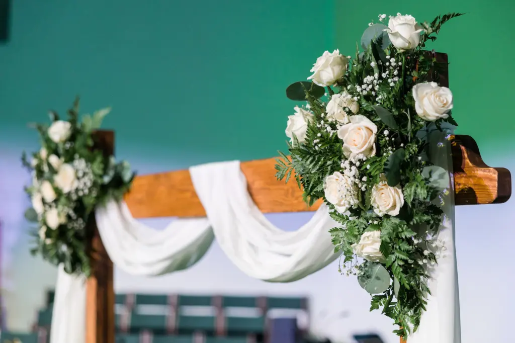 White Roses, Baby's Breath, Fern, and Greenery Arch Decor for Christmas Wedding Ceremony Inspiration