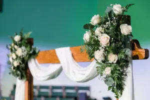 White Roses, Baby's Breath, Fern, and Greenery Arch Decor for Christmas Wedding Ceremony Inspiration