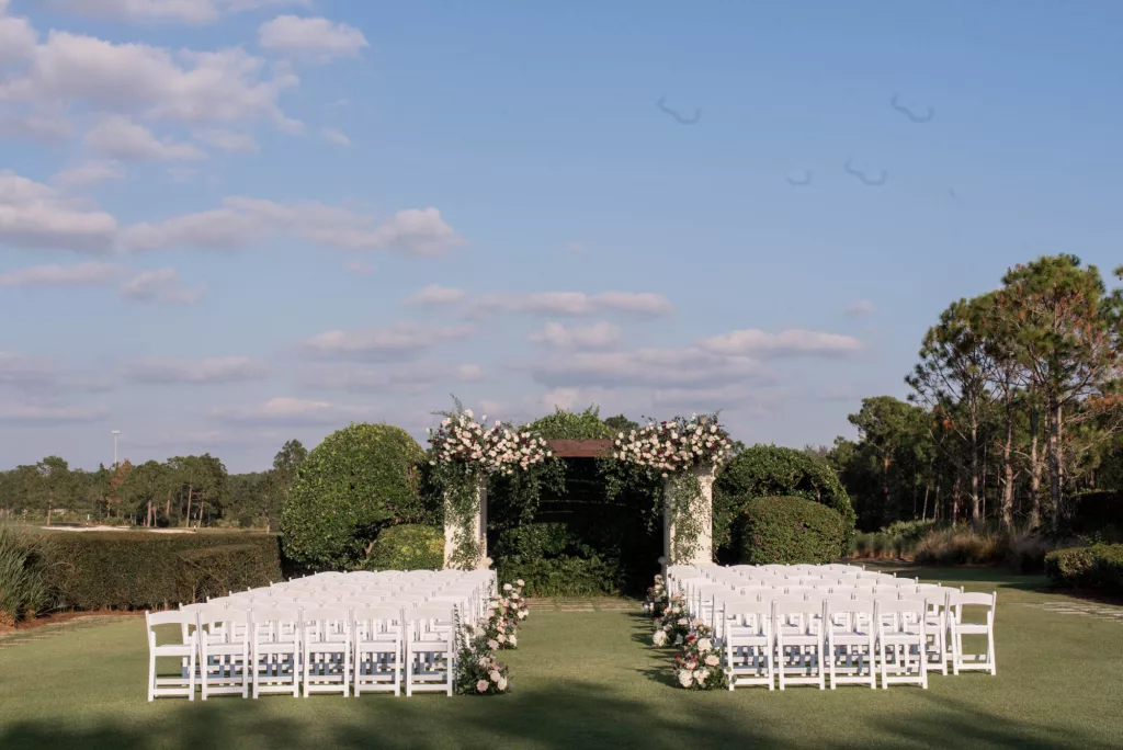 Luxurious Outdoor Wedding Ceremony on the Event Lawn Decor Inspiration | White Folding Garden Chairs | Sarasota Venue The Concession Golf Club | Planner Parties A La Carte | Florist Bruce Wayne Florals