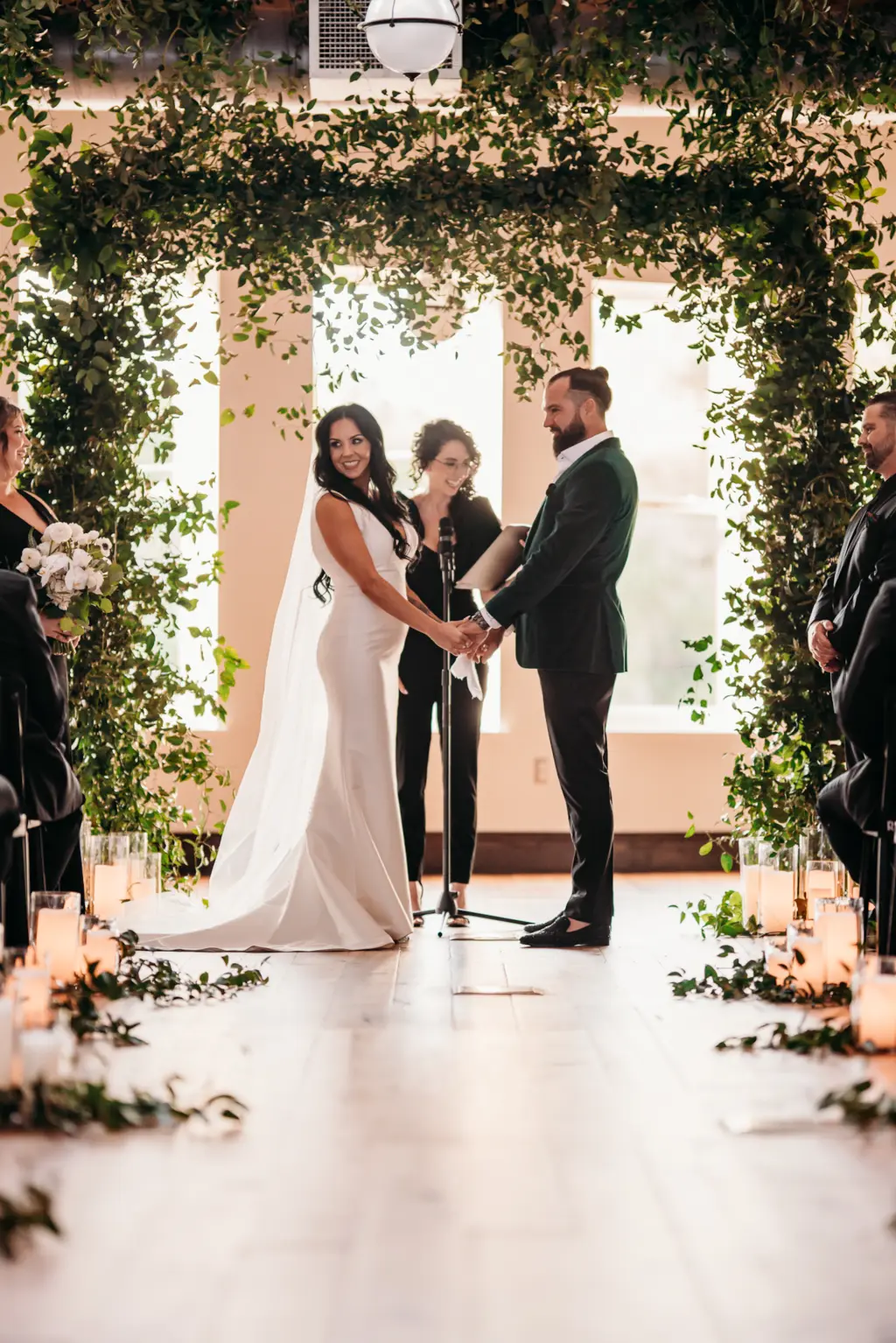 Classic Cascading Lush Greenery Arch Decor Ideas | Modern Black and White Indoor Wedding Ceremony Inspiration