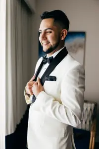 Groom Getting Ready Wedding Portrait | Black and White Tuxedo Jacket with Satin Lapel and Bow Tie Ideas
