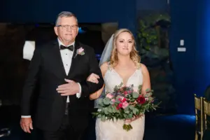 Bride and Father Walking Down Wedding Aisle | Pink Roses, Burgundy Chrysanthemums, and Greenery Bridal Bouquet Ideas | Romantic Hair and Makeup Inspiration