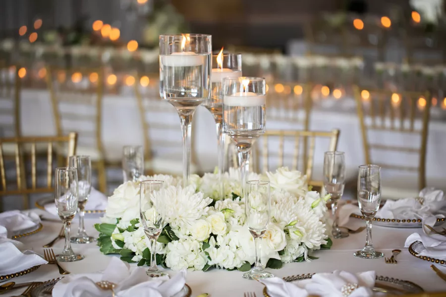 Classic White Monochromatic Wedding Reception Centerpiece Decor Inspiration | Floating Candles, White Chrysanthemums, Roses, and Hydrangeas Floral Arrangement Ideas