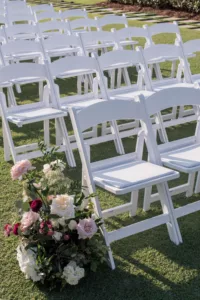 Luxurious Outdoor Wedding Ceremony on the Event Lawn Inspiration | White and Pink Roses, Hydrangeas, Chrysanthemums, and Greenery Aisle Decor Ideas | White Folding Garden Chairs | Tampa Bay Florist Bruce Wayne Florals