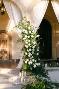 Elegant Wedding Ceremony Floral Column Arch with Pillar Candles, White Roses and Greenery Decor Inspiration