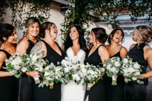 Bridal Party Wedding Updo Hair and Makeup Ideas | Mismatched Black Bridesmaids Dresses | White Roses, Veronica, Anemone, and Eucalyptus Greenery Bouquet Inspiration | Tampa Bay Hair and Makeup Artist Femme Akoi Beauty Studio | Photographer Videographer Sabrina Autumn Photography