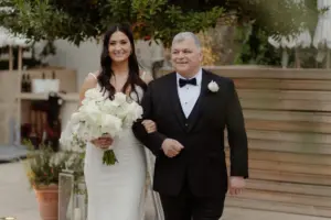 Bride and Father Walking Down Wedding Aisle