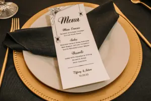 Spider Web Menu Card for Halloween Wedding Reception Dinner Ideas | Black Linen with Gold Chargers and Flatware Table-setting Inspiration