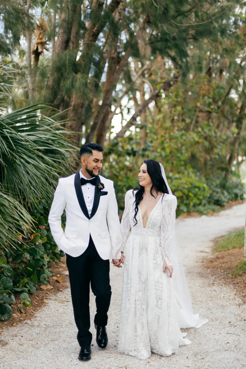Bride and Groom First Look Wedding Portrait | Black and White Tuxedo Jacket with Satin Lapel and Bow Tie Ideas | White and Nude Boho Lace Rue de Seine Wedding Dress with Removable Sleeves