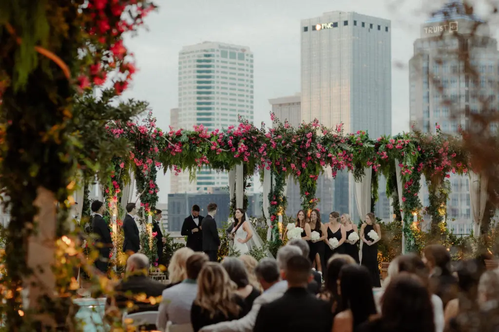 Modern Black and White Rooftop Wedding Ceremony Decor with Pink Bougainvillea Arches | Tampa Bay Event Planner Breezin Weddings | Downtown Tampa Event Venue The Edition Hotel