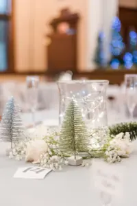 Bottle Brush Christmas Tree, Twinkle Lights, and Baby's Breath Winter Wedding Reception Centerpiece Decor Ideas