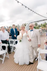 Bride and Father Walking Down Wedding Ceremony Aisle