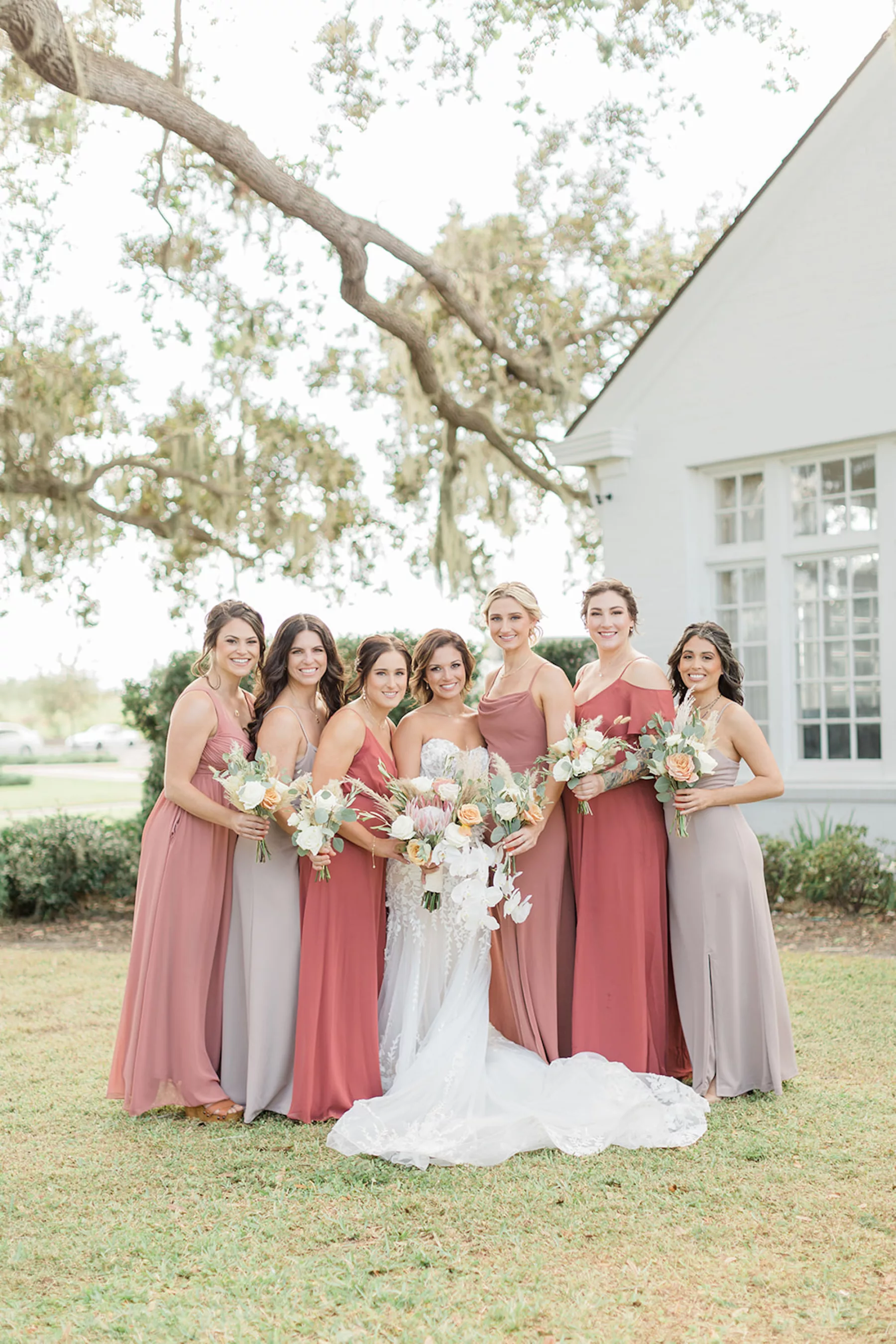 Mismatched Chiffon Floor Length Taupe, Dusty Rose, Terracotta Bridesmaid Dress Ideas | Boho Wedding Bouquets with Pampas Grass, White and Orange Roses, Pink King Protea, Orchids, and Eucalyptus Inspiration | Tampa Bay Hair and Makeup Artist Femme Akoi Beauty Studio