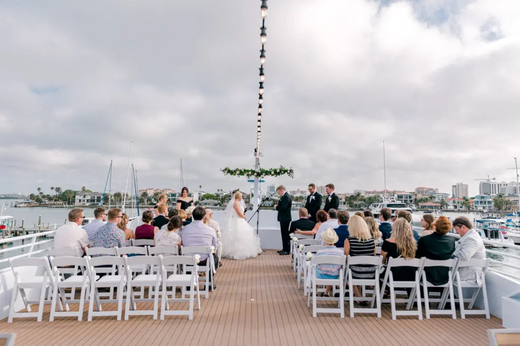 Black Tie Wedding Ceremony on a Boat Inspiration | White Folding Garden Chairs Ideas | Tampa Bay Event Venue Yacht Starship