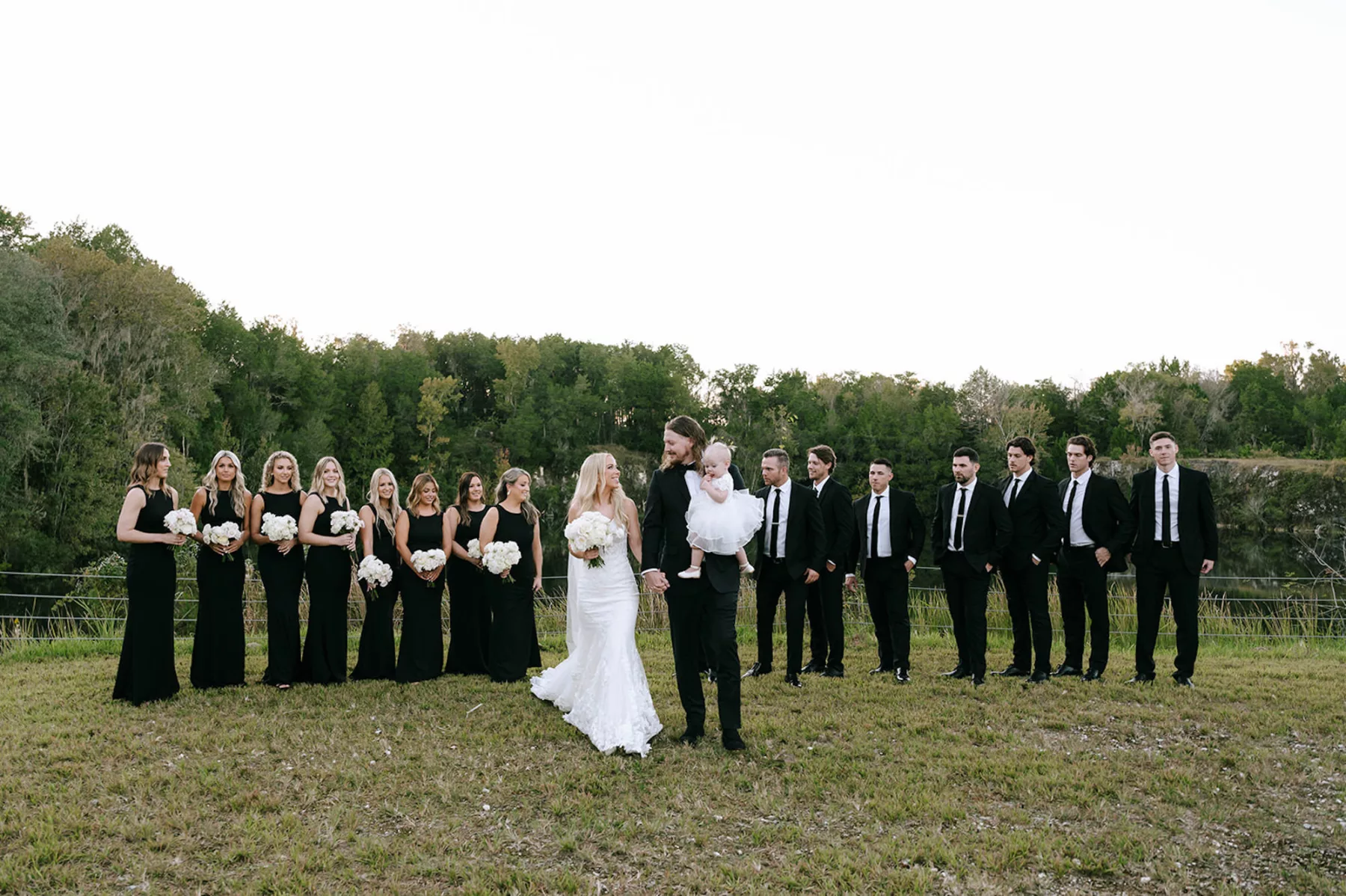 Bridal Party Wedding Attire Inspiration | Matching Black Bridesmaids Dresses | Black Groomsmen Suit and Tie Ideas