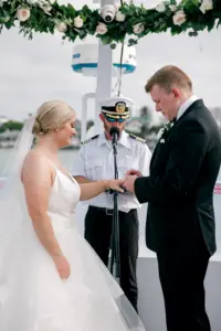 Bride and Groom Ring Exchange | Elegant White Tiered Tulle A-Line Sophia Tolli Wedding Dress Inspiration | Black Tie Yacht Wedding Ceremony Ideas