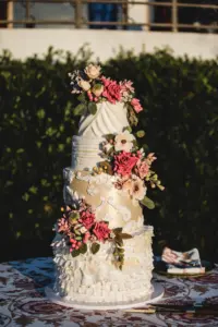 Round Four-Tiered Textured White and Gold Boho Wedding Cake with Pink and Green Gum Paste Flower Accents Inspiration