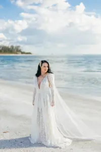 Bride on Longboat Key Resort Beach Wedding Portrait | White and Nude Boho Lace Rue de Seine Wedding Dress with Removable Sleeves | Sarasota Venue Longboat Key Club Resort