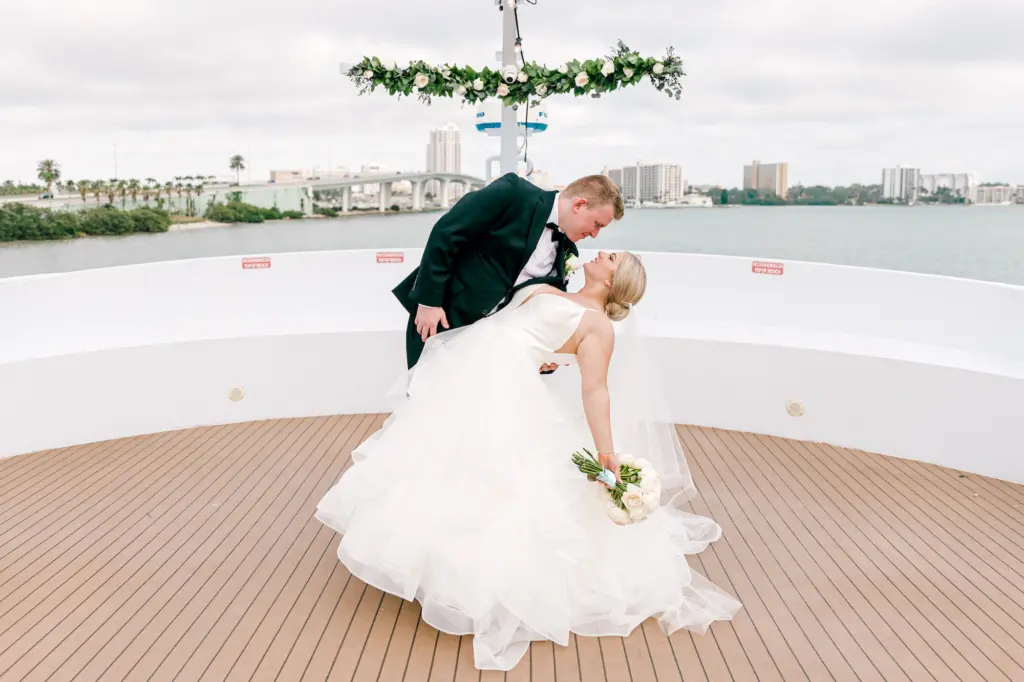 Bride and Groom Just Married Waterfront Wedding Ceremony Portrait | White Rose and Greenery Garland Altar Decor Inspiration | Clearwater Venue Yacht StarShip